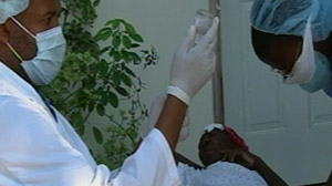 With few hospitals still functioning in rubble-strewn Port-au-Prince, one couple who live there, both doctors, have found themselves running a makeshift clinic right out of their own home.