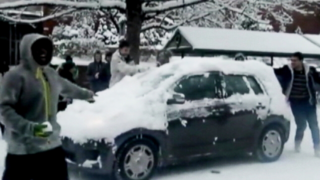 VIDEO: University of Oregon students were caught on tape hurling snowballs at moving vehicles.