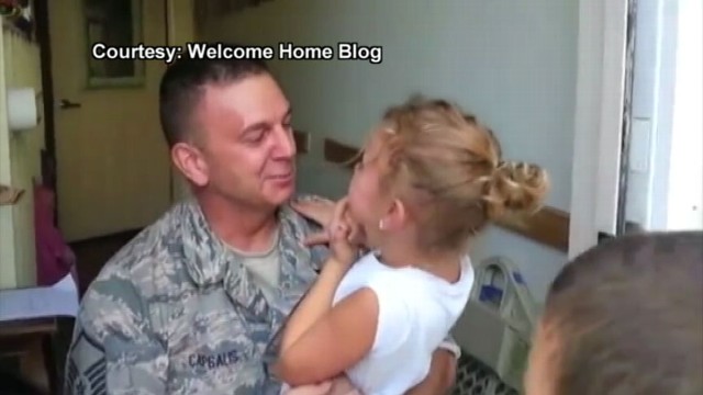 VIDEO: U.S. Airman Surprises Young Daughter at School, notices she lost a tooth.