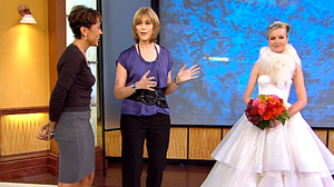 PHOTO Rosa Claras ivory, silk-satin, organza, strapless ball gown with corset bodice and tiered ball gown skirt is shown, right, in this television screen grab from "Good Morning America," Oct. 8, 2010.