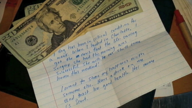 VIDEO: Woman, relieved her dogs surgery went well, left $60 for her waitress at the airport in North Carolina.