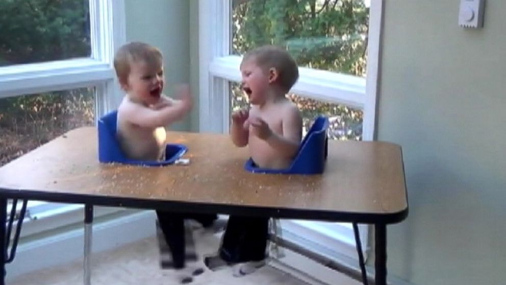 Twin brothers, Henry and Graham, have far too much fun at dinner time.