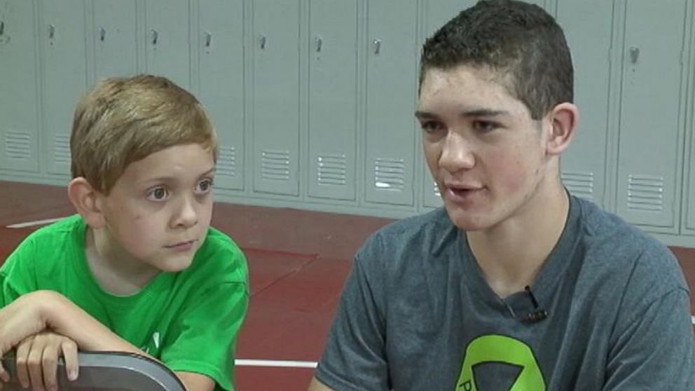 Hunter Gandee will walk from his high school to the University of Michigan with his brother, 7, on his back.