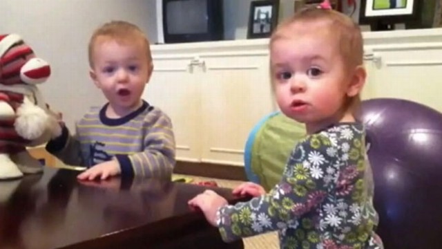 VIDEO: Twin 21-month-old babies Eliana and Evan love dancing to their musical monkey toy.