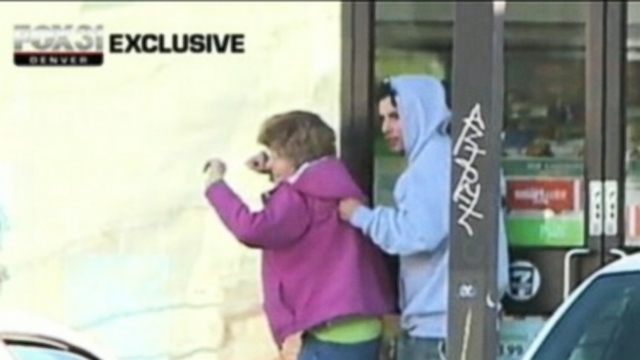 VIDEO: Denver police fired at the suspect after he emerged from the store with a female hostage.