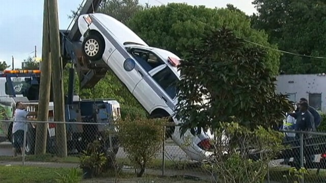 VIDEO: A Miami cop lost control of his cruiser and drove up a utility pole.