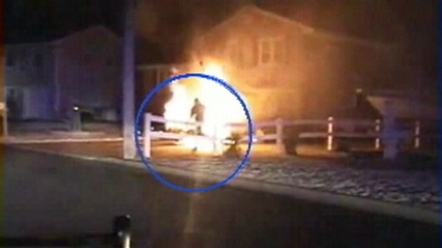 VIDEO: Officers in Barnegat, N.J., fought flames to save a trapped driver.