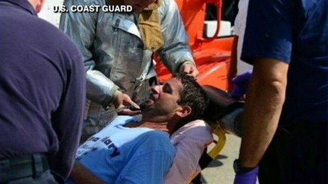 VIDEO: The U.S. Coast Guard rescued John Aldridge, 45, who used his rubber boots to stay afloat.