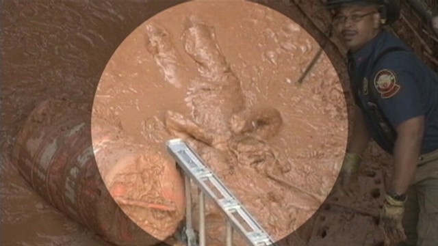 VIDEO: The Georgia man was pulled to safety after falling into a muddy pit.