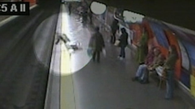VIDEO: An off-duty officer in Spain sprung into action and pulled the woman to safety.