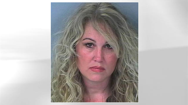 PHOTO Florida police say Jennifer Dennison, shown in this booking photo, nearly drained an elderly couples bank and retirement accounts to pay for her alleged gambling addiction.