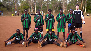 PHOTO Josh Nesbit playing soccer with a sports team in Malawi.