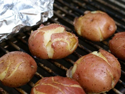 Erin Chase grills red potatoes for