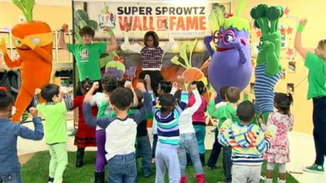 The first lady stretched and danced with suburban Washington school kids to promote a healthy lifestyle.