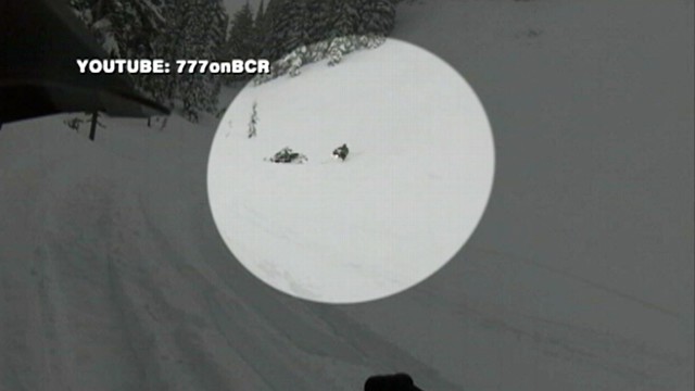 VIDEO: A snowmobiler in Washington is pulled from a deluge of snow by his friends.