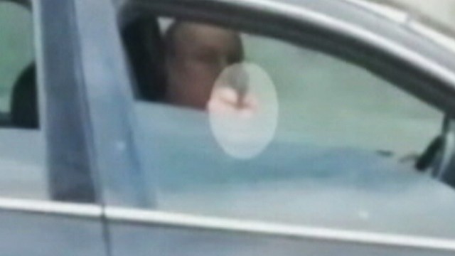 VIDEO: A driver has been arrested after pointing a gun at another motorist during a highway drive.
