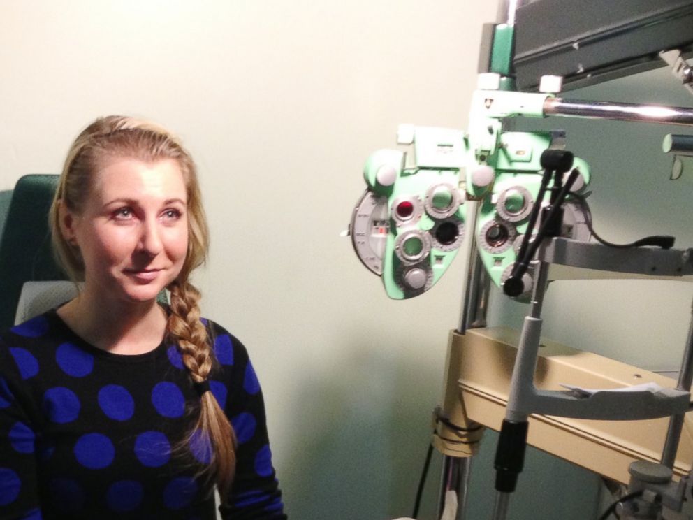 PHOTO:Lucy Luckayanko, 25, sits in the examining room at Dr. Emil Chins practice for a check-up on her newly implanted heart-shaped eye jewelry.