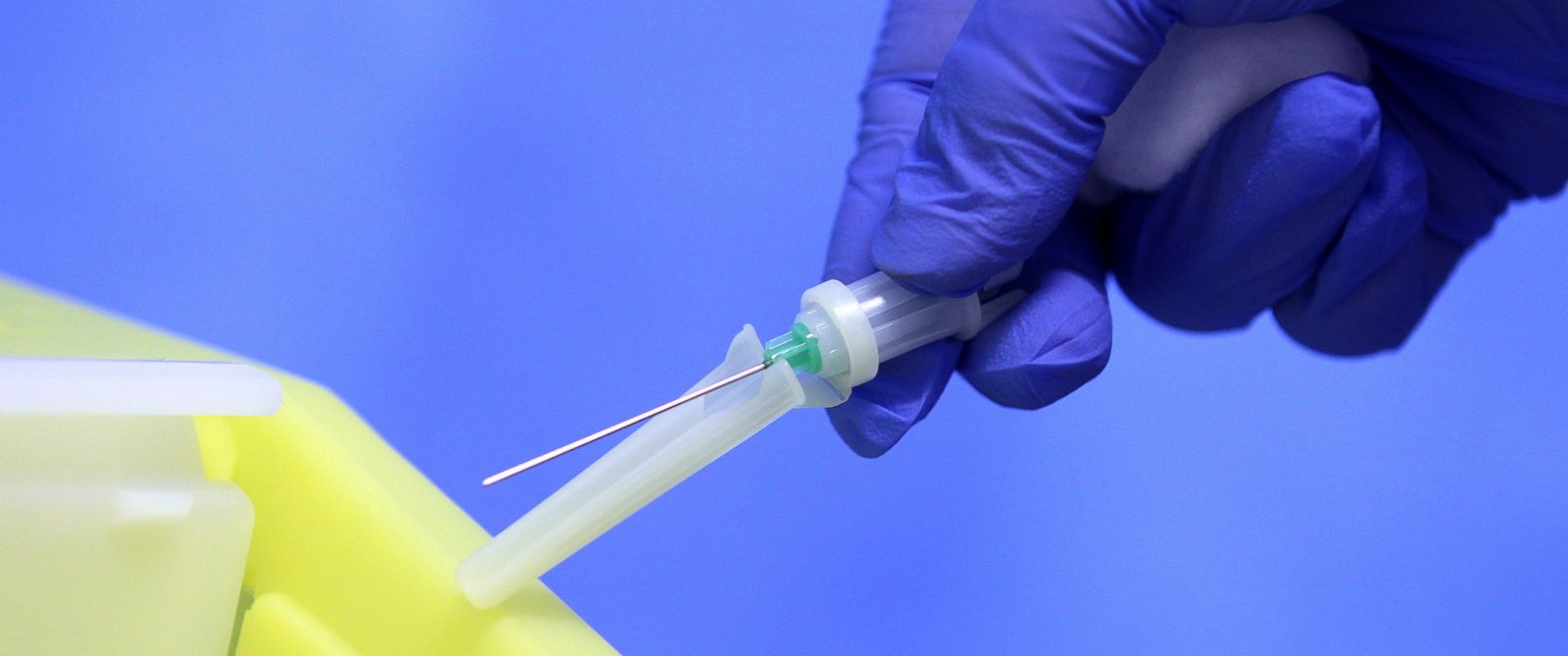PHOTO: A medical professional holds a needle at the Royal Liverpool University Hospital, Liverpool. 