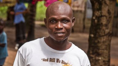 PHOTO: Sulaiman Kemokai, an Ebola virus survivor, is pictured near his house in Sierra Leone on Aug. 11, 2014. 