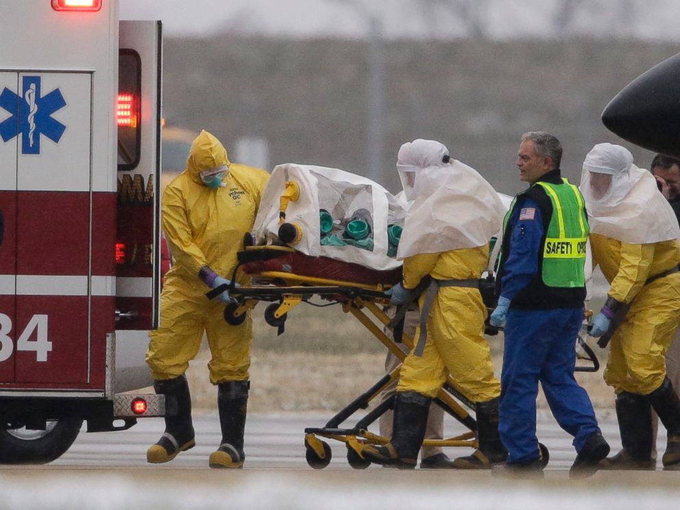 PHOTO: Health workers in protective suits transport Dr. Martin Salia, Nov. 15, 2014.