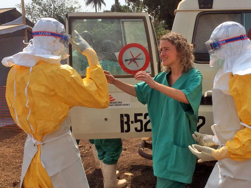 PHOTO: Healthcare workers from the organization Medecins Sans Frontieres (Doctors without Borders), prepare isolation and treatment areas for their Ebola, hemorrhagic fever operations, in Gueckedou, Guinea, March 28, 2014.
