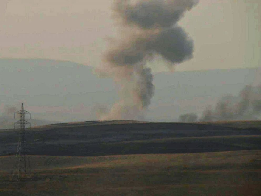 PHOTO: This image made from AP video shows smoke rising from airstrikes targeting Islamic State militants near the Khazer checkpoint outside of the city of Erbil in northern Iraq, Aug. 8, 2014.