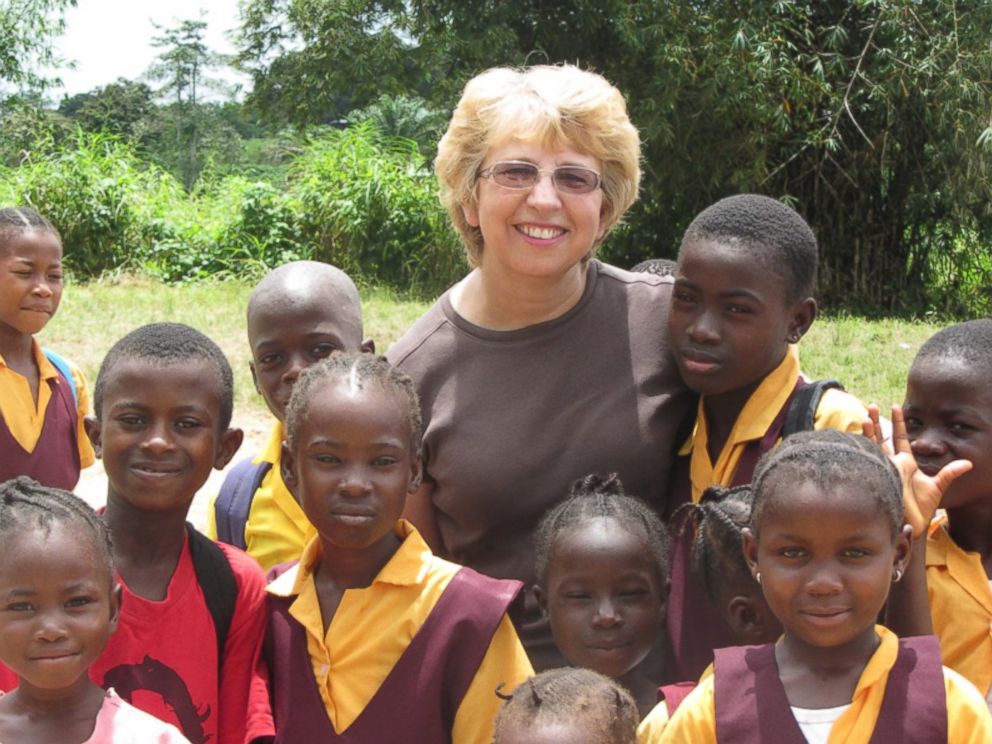 PHOTO: This Oct. 7, 2013 photo provided by Jeremy Writebol shows his mother, Nancy Writebol, with children in Liberia. 