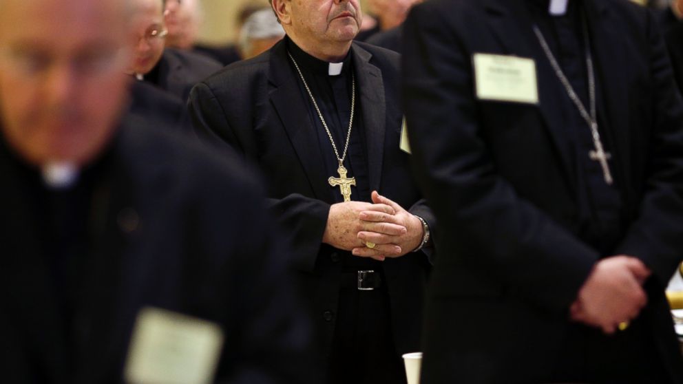 PHOTO: Bishops stand during a prayer at the United States Conference of Catholic Bishops annual fall meeting in Baltimore, Nov. 11, 2013.