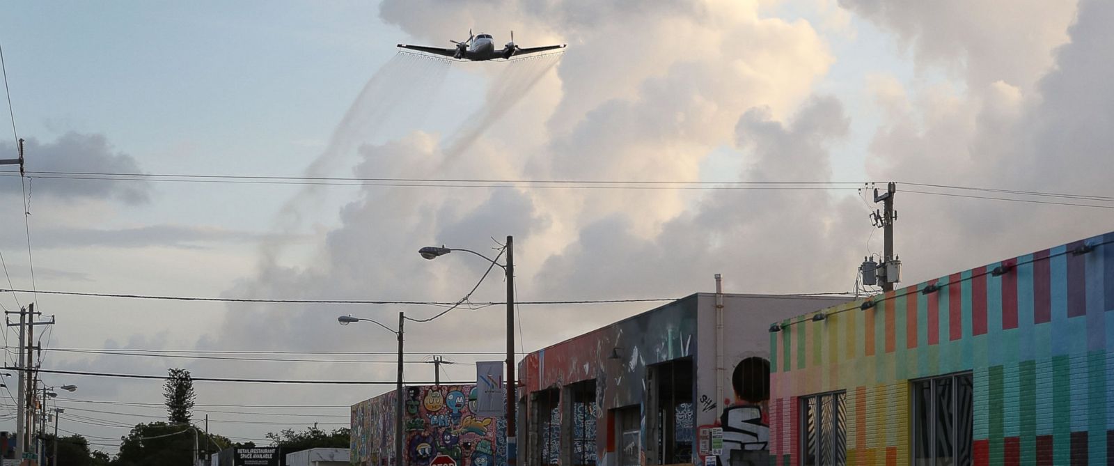PHOTO:A plane sprays pesticide over the Wynwood neighborhood of Miami, FL in the hope of controlling and reducing the number of mosquitos, some of which may be capable of spreading the Zika virus on August 6, 2016.