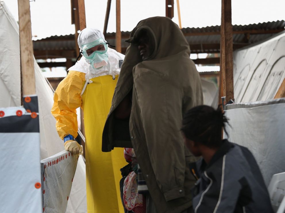 PHOTO: A staffer for Doctors Without Borders admits new patients to the MSF Ebola treatment center on Aug. 21, 2014 near Monrovia, Liberia.