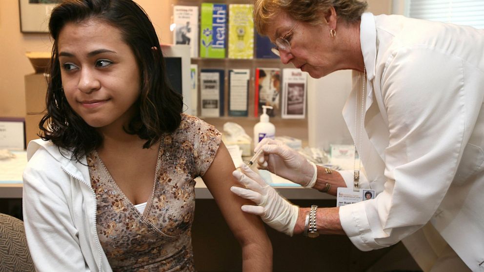 PHOTO: University of Iowa junior Erica Zamudil receives a mumps, measles and rubella vaccination