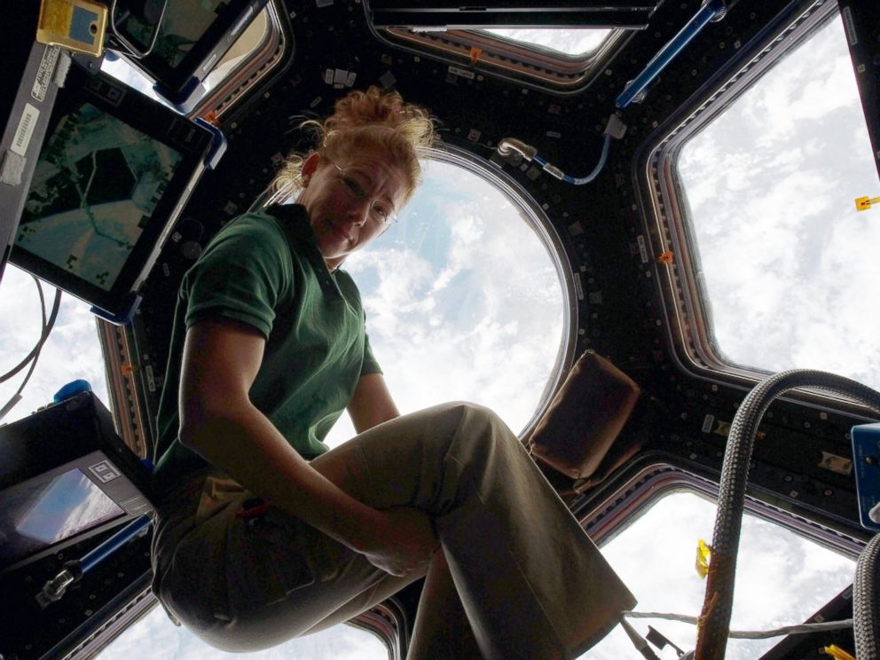 PHOTO: NASA astronaut Sandy Magnus, STS-135 mission specialist, gets one last visit to the Cupola onboard the International Space Station before the two spacecraft undocked, July 18, 2011, in space.