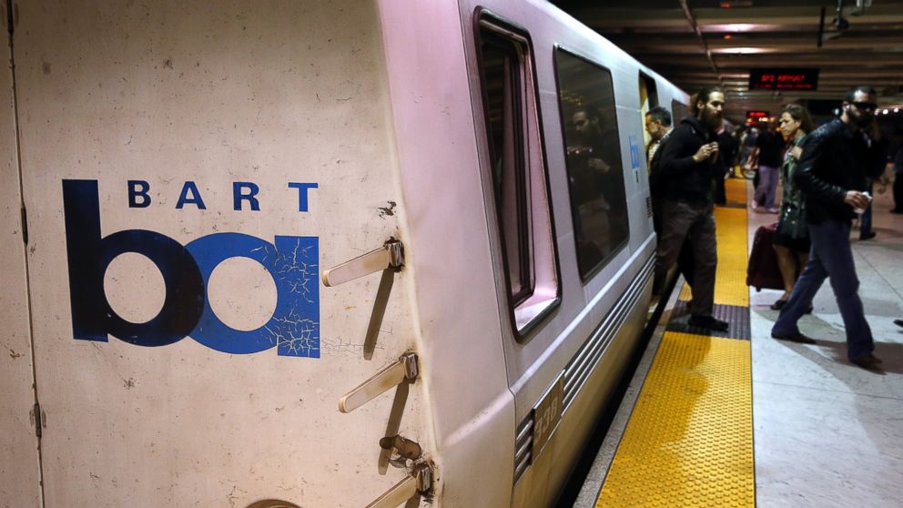 PHOTO: Bay Area Rapid Transit (BART) passengers walk off of a train on October 15, 2013, San Francisco, Calif.