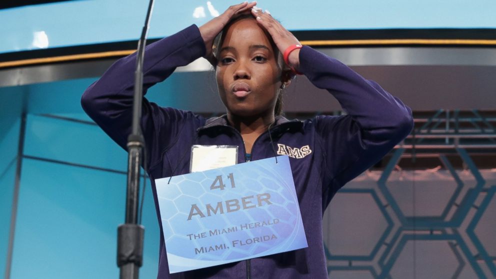 PHOTO: Speller Amber Robinson of Homestead, Florida, reacts as she participates during round three of the 2014 Scripps National Spelling Bee competition, May 28, 2014 in National Harbor, Md.