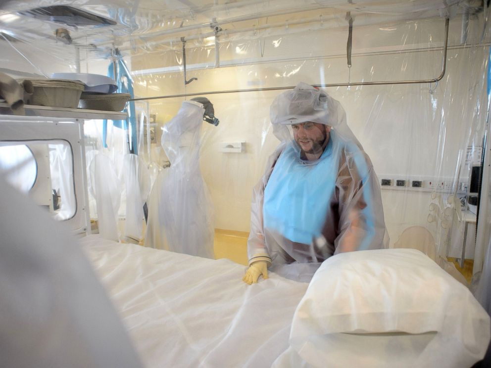 PHOTO: A nurse wears protective clothing as he demonstrates the facilities in place at the Royal Free Hospital in north London, Aug. 6, 2014, in preparation for a patient testing positive for the Ebola virus.