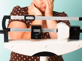 teen self weighing on scale