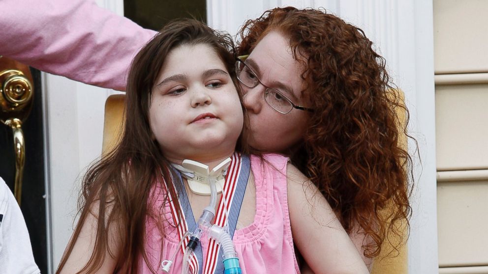 PHOTO: Sarah Murnaghan sits on her mother Janets lap outside their home in Newtown Square, Penn.
