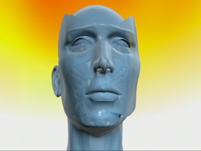 VIDEO: A computer image of a face without skin.