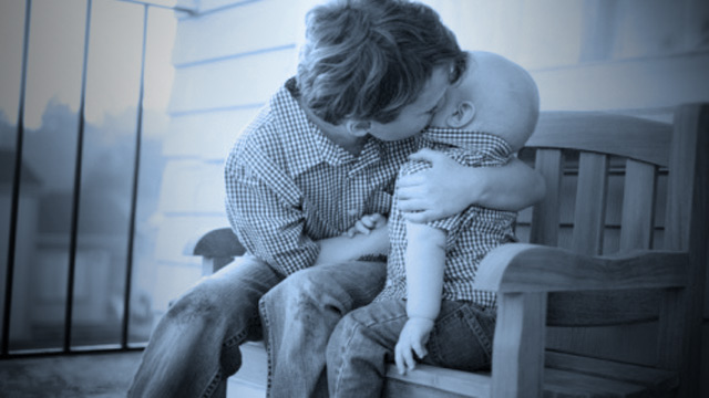 PHOTO: Autistic boy with infant brother