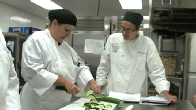 PHOTO: Cook for America co-founder Andrea Martin instructs school cafeteria workers on re-learning the basics of cooking from scratch.