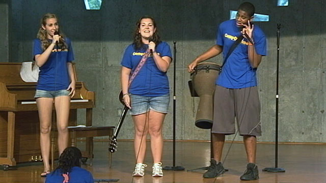 PHOTO: Alina Davis, center, sings a song she co-wrote with her friends at Camp Our Time.
