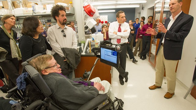 PHOTO: Stephen Hawking, listens to Robert H. Baloh, MD, PhD, the Director of Neuromuscular Medicine in the Department of Neurology, as he was given a tour of the Regenerative Medicine Institute at Cedars-Sinai Medical Center, April 9, 2013, in Los Angeles