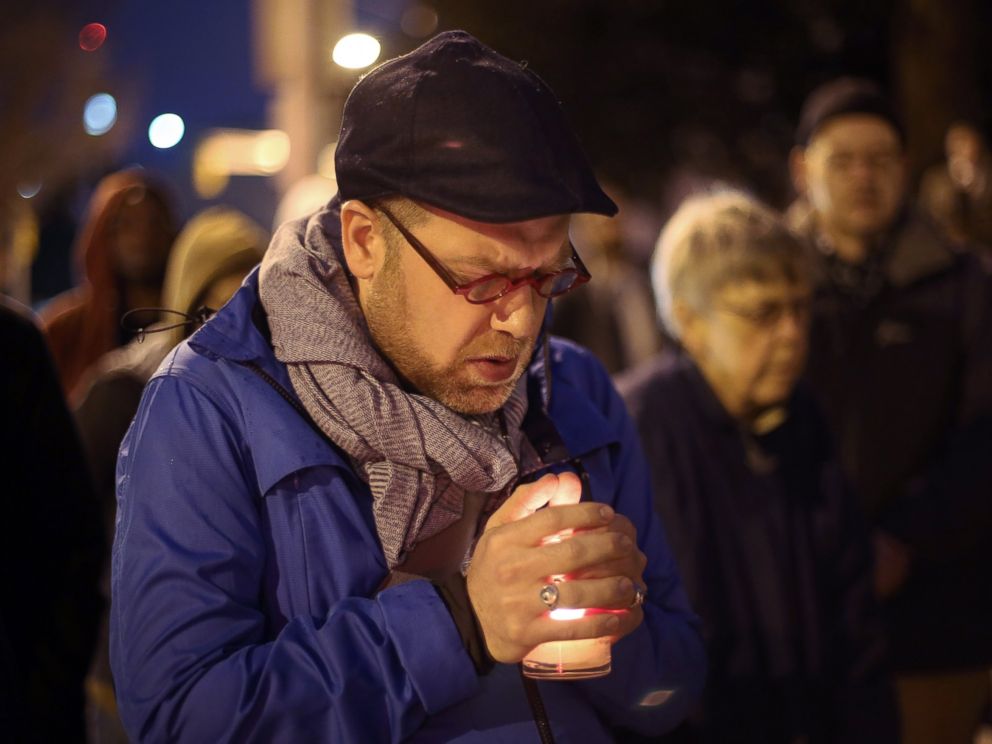 PHOTO: Michael Patter, senior minister at Central Congregational United Church of Christ, prays silently during a vigil for Kelly Gissendaner and protest against the death penalty on March 2, 2015, on the steps of the State Capitol.