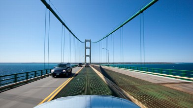 Cars cross the Straits of Mackinac as they drive over the Mackinac Bridge in Michigan, May 17, 2009.