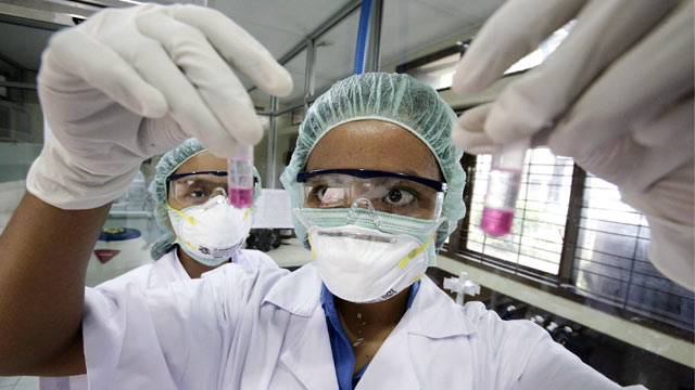 PHOTO: A scientist tests genetic material of Avian Influenza for the H5N1 strain at The Molecular Biology Laboratory of Udayana Universitys School of Veterinary Medicine in Denpasari, Indonesia.