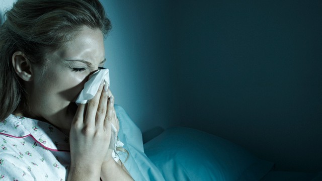 PHOTO: Woman blowing her nose