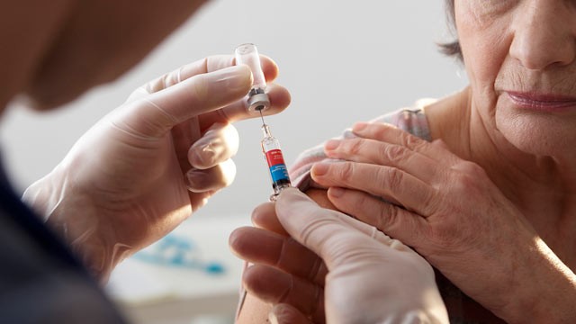 PHOTO: An elderly person receives a flu vaccine.