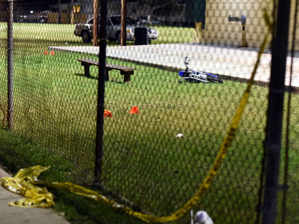 PHOTO: Evidence markers sit on the ground after a shooting at a playground on Nov. 22, 2015 in New Orleans.