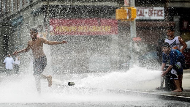 PHOTO: Children play in water sprayed from a fire hydrant on June 9, 2011 in the Bronx borough of New York City.