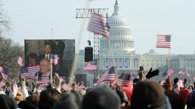 PHOTO: A large crowd cheers at the Washington Monument as Barack Obama prepares to take the oath of office during the Presidential inauguration in Washington on Jan. 20, 2009.